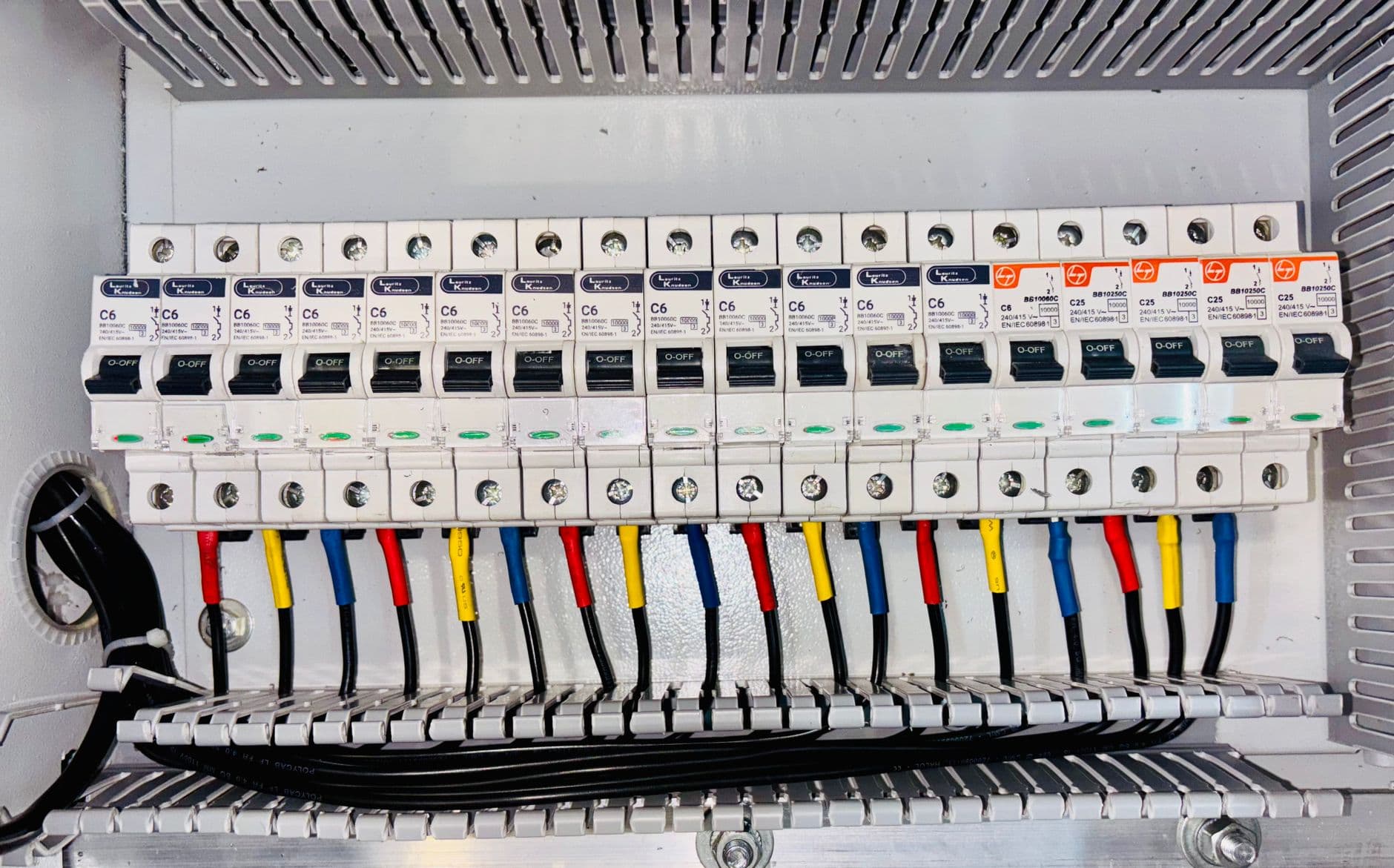 Tidy circuit-breaker panel with neatly labelled circuits (illustrative image)